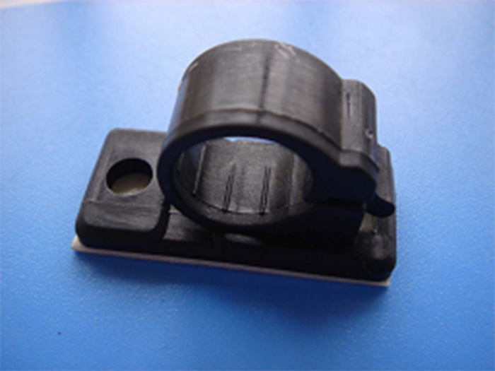 SELF-ADHESIVE CABLE CLAMP